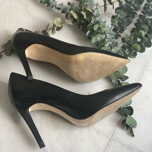 Black leather pumps